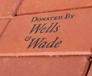 Engraved brick reads 'DONATED BY Wells & Wade.