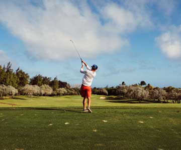 Golfer Swinging Golf Club