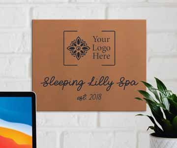 Company sign displayed on a white wall.