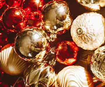 Small Christmas ornament balls in festive colors.