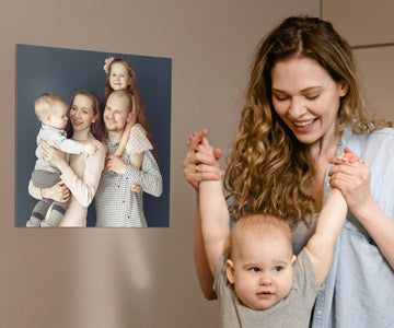 Woman Holding Baby Near Custom Printed Metal Photo Prints
