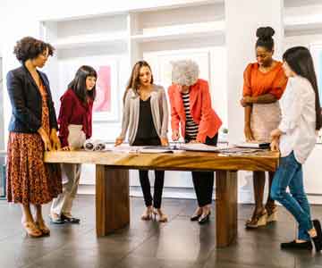 group of women brain storming at an office
