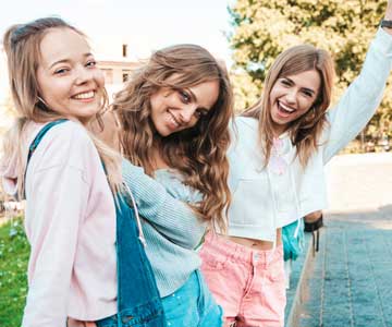 Three sisters together for a group picture.