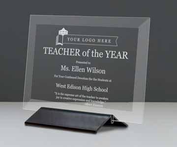 Teacher of the year award in a glass plaque
