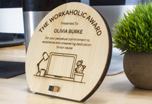 Custom Round Bamboo Wood Award On Desk With Desktop Computer.