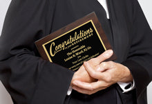 Laser Engraved Retirement Plaque In Black And Gold Held By Judge.