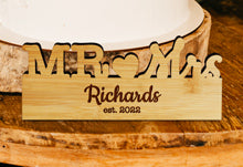 Custom Engraved Wedding Sign Near Wedding Cake.