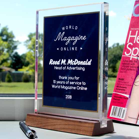 Custom Blue Marble And Gold Acrylic Award For Years Of Service With Wooden Stand On Office Window Shelf With Pen And Magazine