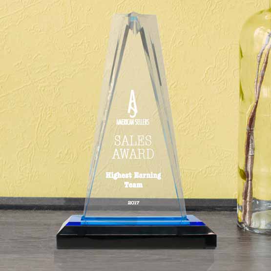 Custom Star Tower Acrylic Award For Sales Team With Logo And Name And Blue Mirror Base On Shelf With Glass Vase