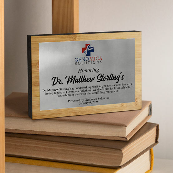 Customized Bamboo Trophy w/ an Aluminum plate with full color printing. Displayed freestanding on pile of books