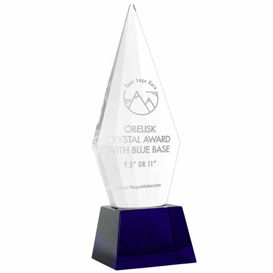 Custom Faceted Obelisk Glass Award Showing Customizable Areas For Text And Art And Standing Via Blue Pedestal Base
