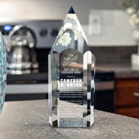 Custom Pencil Shaped Glass Award For Top Sales With Logo And Name And Message On Kitchen Island Counter Nearby Stove