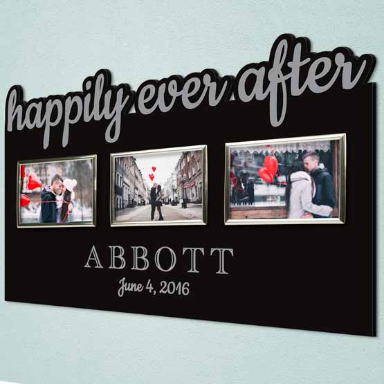 Custom Black Acrylic Sign With Three Silver Picture Frames And Couple Photos And Cutout Of Happily Ever After Hanging On Wall