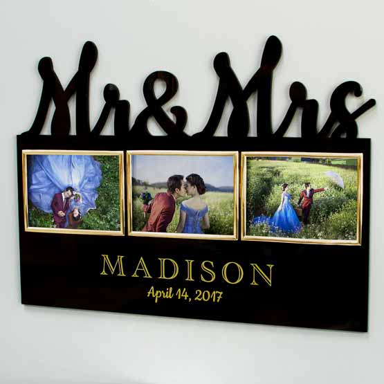 Custom Black Acrylic Sign With Mister And Missus Cutout And Three Gold Picture Frames And Couple Photos Hanging On Wall