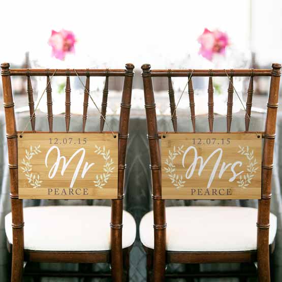 Pair Of Custom Bamboo Chair Signs With Full Color Printings Of Wheat Artwork And Mr And Mrs Pearce Text On Wedding Chairs