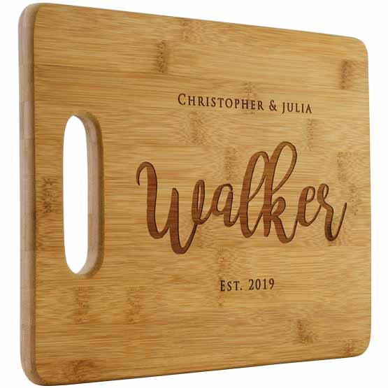 Custom Bamboo Cutting Board Laser Engraved With Couple Names And Family Name And Established Date Against White Background