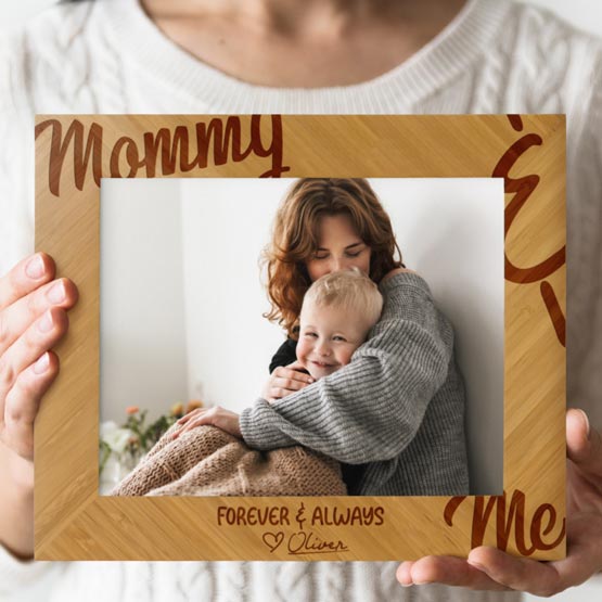 Woman Hands Holding Custom Bamboo Picture Frame Laser Engraved With Mommy And Me Text And Photo Of Mother With Baby