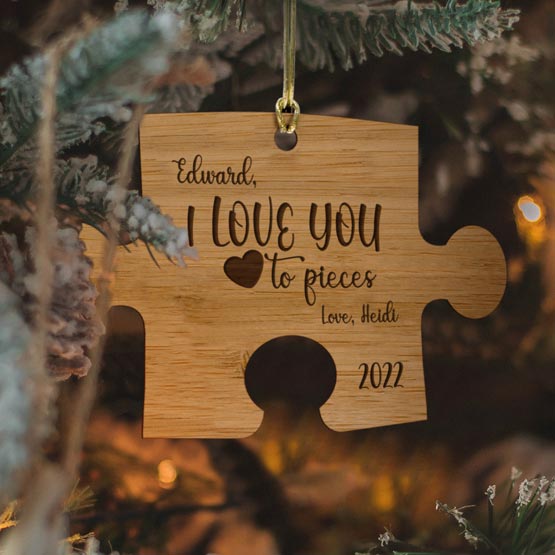 Custom Puzzle Piece Bamboo Ornament Engraved With I Love You To Pieces And Names And Date Hanging On Christmas Tree