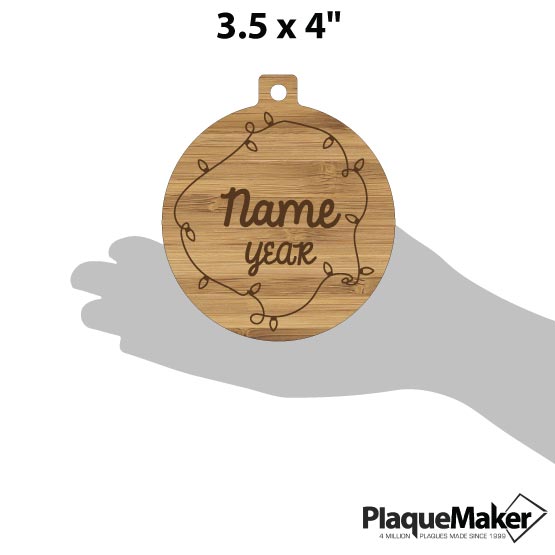 Size Guide With Blank Hand Holding Circle Bamboo Ornament Engraved With Christmas Lights And Showing Customizable Areas