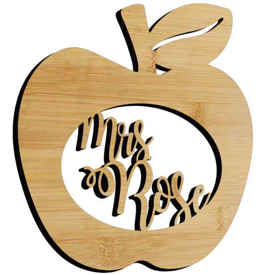 Custom Apple Shaped Bamboo Sign With Teacher Name Inside Oval Cutout And Set Against A White Background