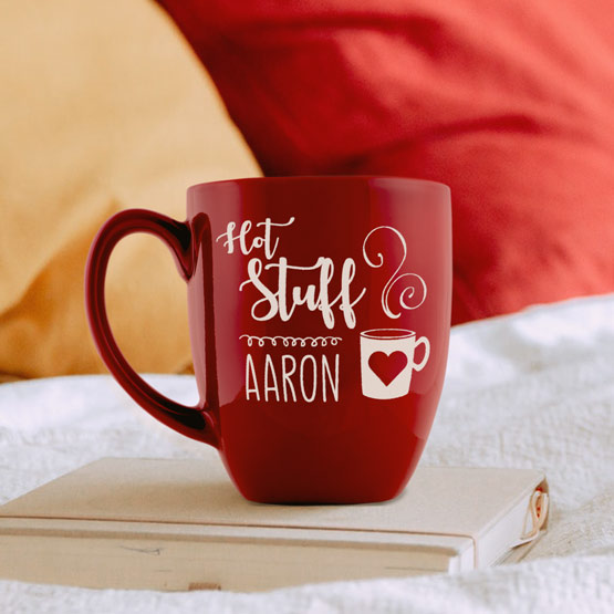 Custom Red Ceramic Bistro Mug Engraved With Hot Stuff And Steaming Mug Art And Aaron On A Book In Bed
