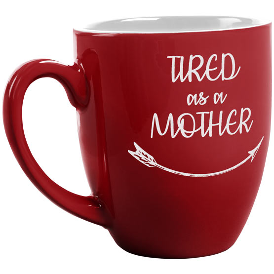Custom Red Ceramic Bistro Mug Laser Engraved With Tired As A Mother Text And Arrow Artwork Against A White Background