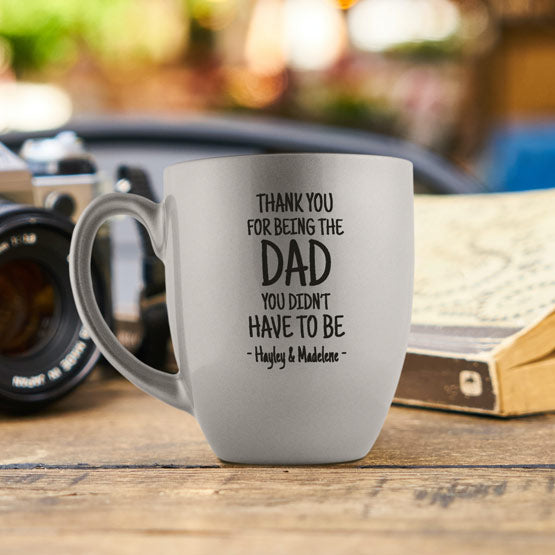 Silver Ceramic Bistro Mug Engraved With Dad Appreciation Message And Family Names On Wood Table With Book And Camera