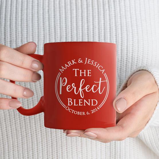 Woman Hands Holding Custom Orange Coffee Mug Engraved With Couple Names And The Perfect Blend Text And Date