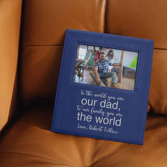 Blue And Silver Faux Leather Picture Frame With Family Photo And Engraved With Dad Appreciation Text On A Brown Couch