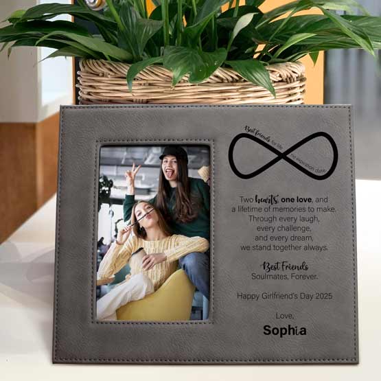 Gray Faux Leather Picture Frame With Photo Of Two Women And Engraved With Infinity Icon And Sweet Message On Stand With Plant