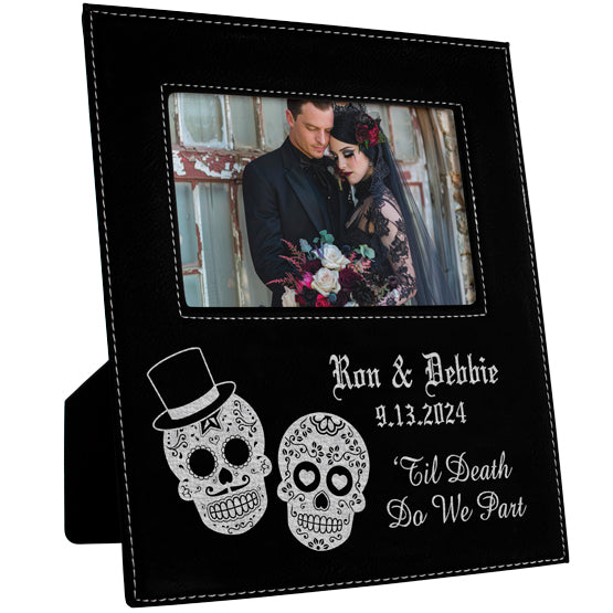 Custom Black Faux Leather Picture Frame With Photo Of Couple In Goth Outfits And Engraved With Bride And Groom Sugar Skulls