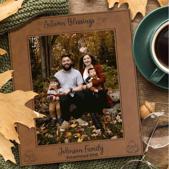 Rawhide Faux Leather Picture Frame With Family Photo And Engraved With Autumn Blessings And Family Name On Table With Coffee