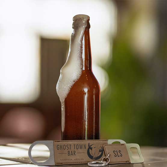 Set Of Custom Dark Brown Faux Leather Bottle Opener Engraved With Ghost Town Bar And A Small Keychain Bottle Opener Near Beer