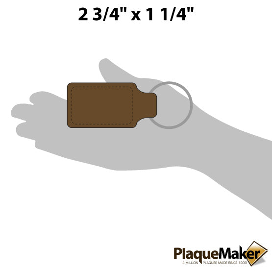 Size Guide With Blank Hand Holding Custom Dark Brown Faux Leather Rectangle Keychain Against A White Background