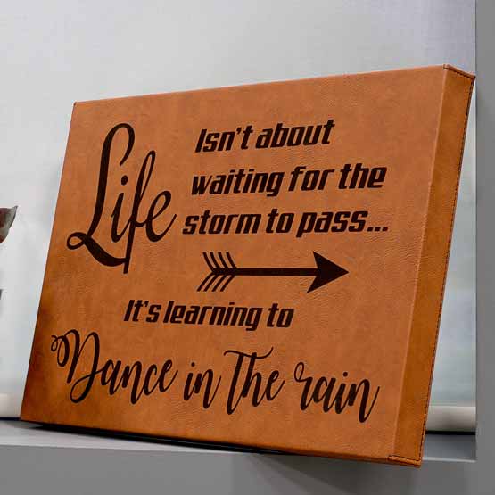 Rawhide Faux Leather Wrapped Rectangle Canvas Engraved With Life Is Learning To Dance In The Rain Message On A Window Sill