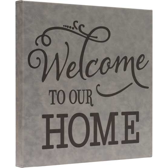 Custom Gray Faux Leather Wrapped Square Canvas Laser Engraved With Welcome To Our Home Against A White Background
