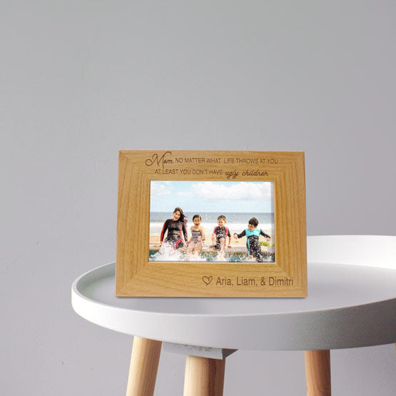 Red Alder Picture Frame With Children Photo And Engraved With Names And Funny Message For Mom On White Side Table