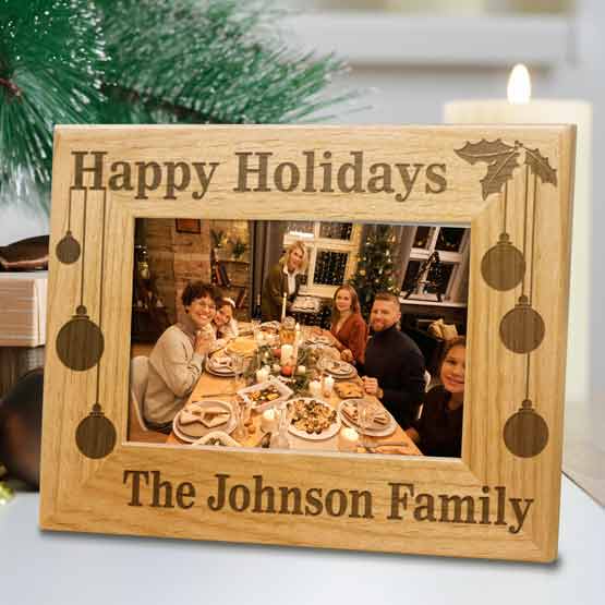 Red Alder Picture Frame With Family Dinner Photo And Engraved With Happy Holidays And The Johnson Family On Shelf With Decor