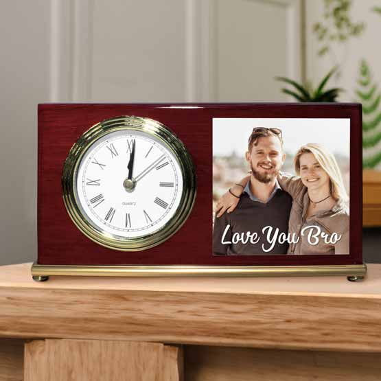Rosewood Landscape Desk Clock With Gold Trim And Metal Plate Featuring Siblings Photo And Love You Bro Text On Wood Shelf