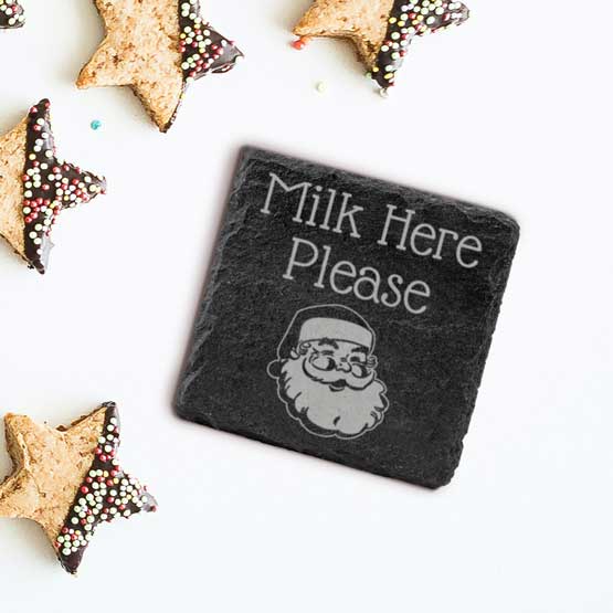 Custom Slate Square Coaster Printed With Milk Here Please And Santa Face Art On A White Table With Star Shaped Cookies