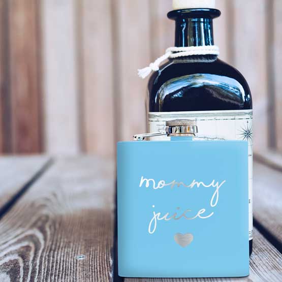 Light Blue Powder Coated Stainless Steel Flask Laser Engraved With Mommy Juice Text And Heart On Wood Table With Bottle