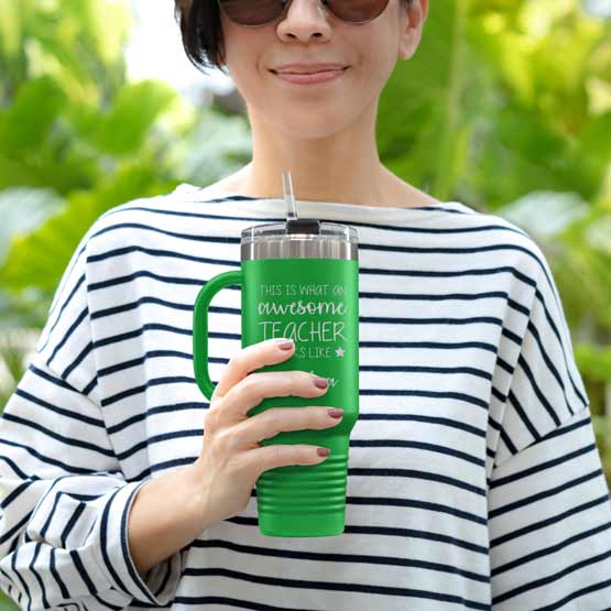 Happy Woman Outdoors Holding Custom Green Stainless Steel Coffee Tumbler With Handle And Straw And Teacher Message