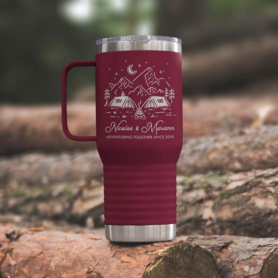 Maroon Stainless Steel Coffee Tumbler With Handle And Engraving Of Camping Art And Names And Date On Wood Log Outdoors