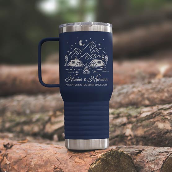 Navy Blue Stainless Steel Coffee Tumbler With Handle And Engraving Of Camping Art And Names And Date On Wood Log Outdoors