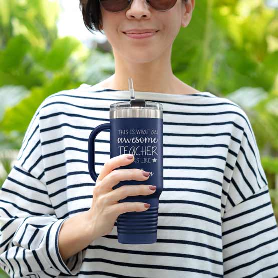Happy Woman Outdoors Holding Custom Navy Blue Stainless Steel Coffee Tumbler With Handle And Straw And Teacher Message
