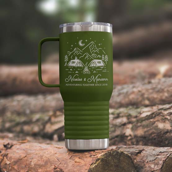 Olive Green Stainless Steel Coffee Tumbler With Handle And Engraving Of Camping Art And Names And Date On Wood Log Outdoors