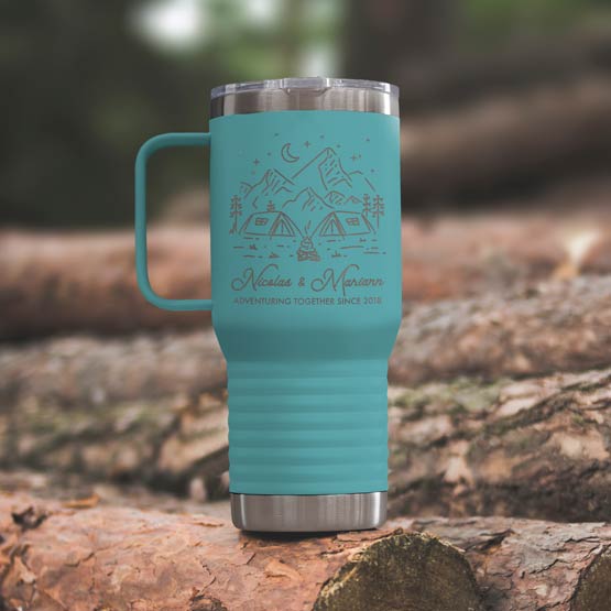 Teal Stainless Steel Coffee Tumbler With Handle And Engraving Of Camping Art And Names And Date On Wood Log Outdoors