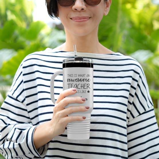 Happy Woman Outdoors Holding White And Black Stainless Steel Coffee Tumbler With Handle And Straw And Teacher Message