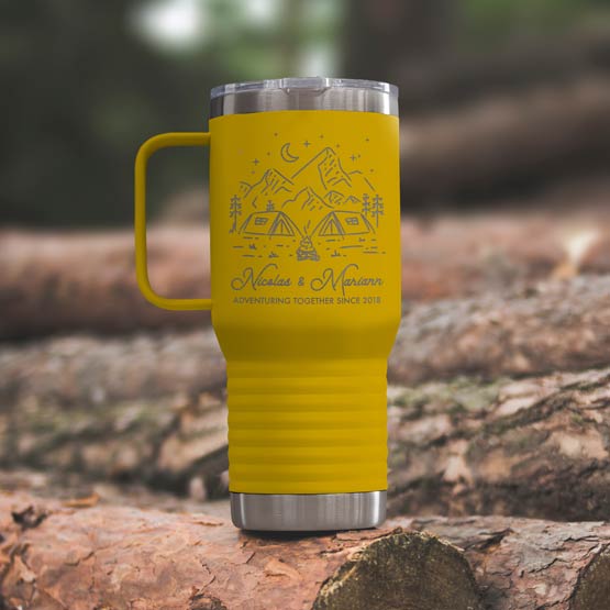 Yellow Stainless Steel Coffee Tumbler With Handle And Engraving Of Camping Art And Names And Date On Wood Log Outdoors