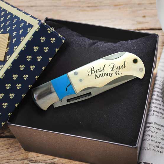 Custom Stainless Steel Folding Knife With Blue And Bone Handle Laser Fused With Best Dad And Name In A Gift Box On Table